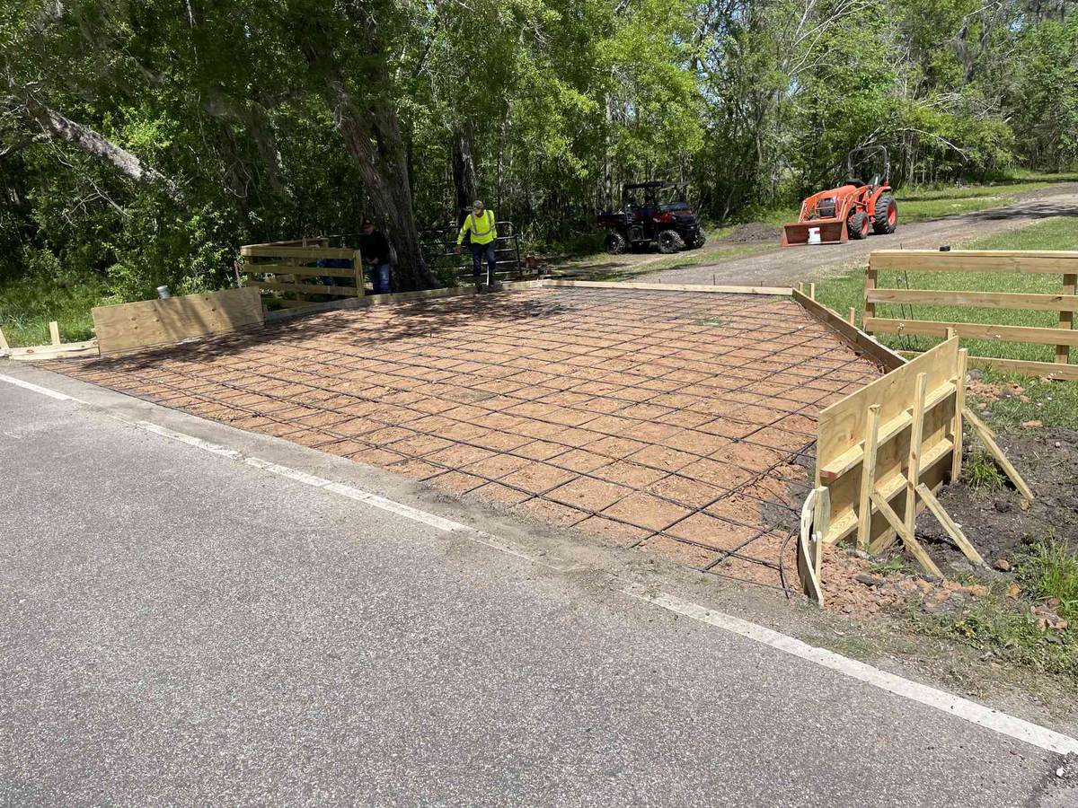 Forms and rebar set for a concrete entrance off a rural road